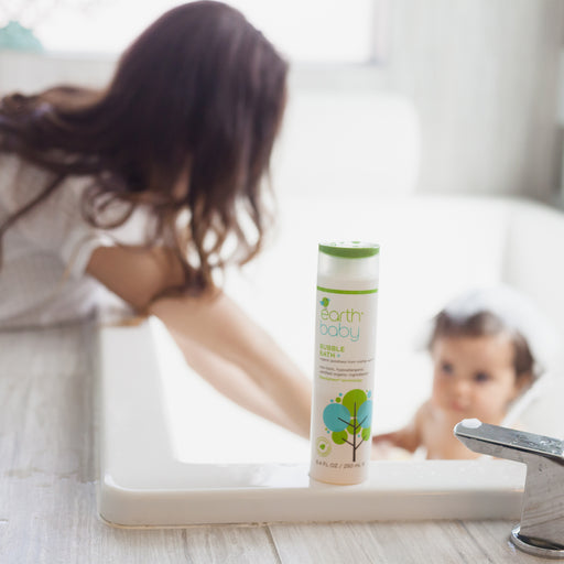 Mother giving baby a bath with Non-Toxic, Hypoallergenic Bubble Bath